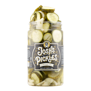 Heritage Dill Slices 35 fl oz open jar with bursting pickles