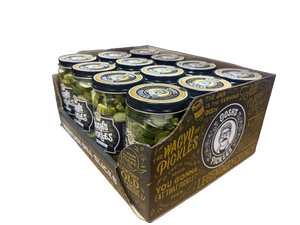 Angled view of a Costco display tray of Josh’s Pickles Heritage Dill Slices 35 fl oz jars, showing the front labels and The Magic of Pickles artwork on the side panel.