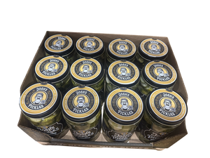 Overhead view of twelve Josh’s Pickles Heritage Dill Slices 35 fl oz jars arranged in three rows of four in a Costco display tray, with branded lids visible.